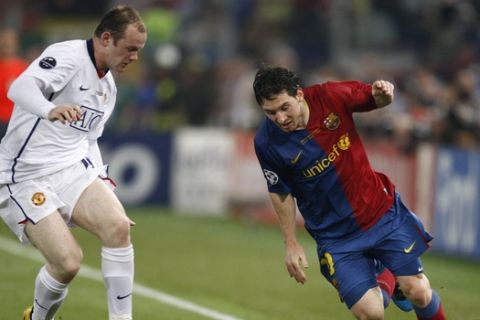 Manchester United's Wayne Rooney, left, and Barcelona's Lionel Messi during the UEFA Champions League final soccer match between Manchester United and Barcelona in Rome, Wednesday May 27, 2009. (AP Photo/Luca Bruno)