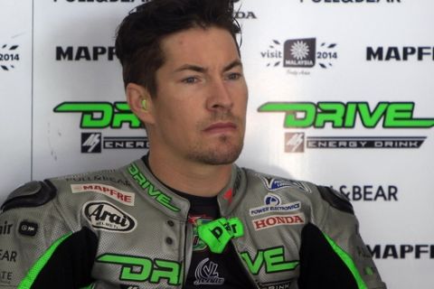 MotoGP rider Nicky Hayden of the United States sits in his pit garage before a free practice ahead of Sunday's Malaysian Motorcycle Grand Prix in Sepang, Malaysia, Friday, Oct. 24, 2014. (AP Photo/Lai Seng Sin)