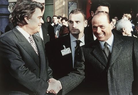Italian Premier Silvio Berlusconi, right, shakes hands with French bankrupted businessman and leftist politician Bernard Tapie at the start of the 15th Franco/Italian summit in Aix-en-Provence, southern France, Dec. 16, 1994. Tapie is deputy of this southeastern French district. (AP Photo/Georges Gobet)