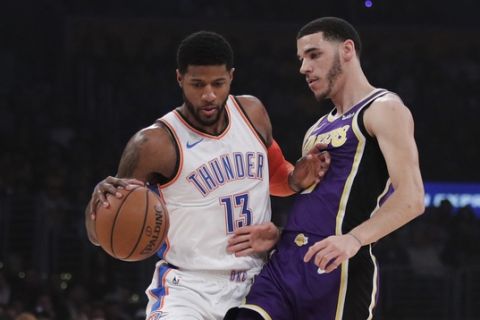 Oklahoma City Thunder's Paul George, left, is pressured by Los Angeles Lakers' Lonzo Ball during the first half of an NBA basketball game Wednesday, Jan. 2, 2019, in Los Angeles. (AP Photo/Jae C. Hong)