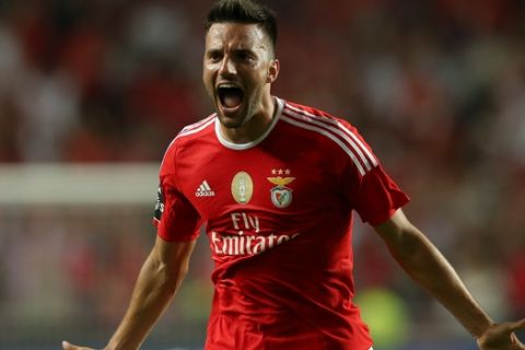 Benfica's Samaris, celebrates after scoring his team's second goal against Moreirense during a Portuguese league soccer match at Benfica's Luz stadium in Lisbon, Saturday, Aug. 29, 2015. (AP Photo/Steven Governo)