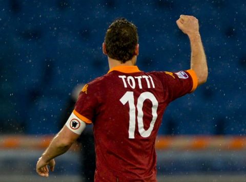 AS Roma forward Francesco Totti celebrates after scoring during the Italian Serie A football match AS Roma vs. Parma on March 17, 2013 at Rome's Olympic stadium. AFP PHOTO / ANDREAS SOLARO        (Photo credit should read ANDREAS SOLARO/AFP/Getty Images)