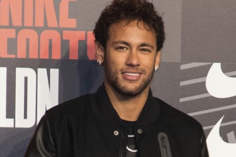 Soccer player Neymar poses for photographers upon arrival at the Nike Celebrates The Beautiful Game event, in London, Wednesday, Feb. 7, 2018. (Photo by Vianney Le Caer/Invision/AP)