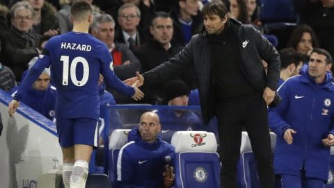 Chelsea's Eden Hazard shoes hands with Chelsea head coach Antonio Conte after being substituted during the English Premier League soccer match between Chelsea and Crystal Palace at Stamford Bridge stadium in London, Saturday, March 10, 2018. (AP Photo/Matt Dunham)
