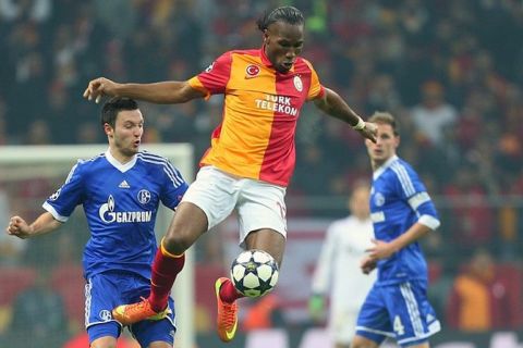Galatasaray's Didier Drogba flies to control the ball during their Champions League round of 16 first leg soccer match against FC Schalke 04 at the TT Arena Stadium in Istanbul, Turkey, Wednesday Feb. 20, 2013. (AP Photo)