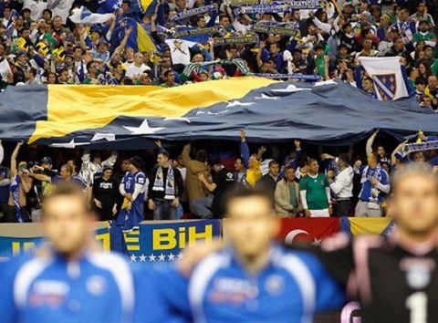 ATLANTA, GA - FEBRUARY 09:  Fans of Bosnia-Herzegovina hold up a large flag during their anthem before facing Mexico during an international friendly match at Georgia Dome on February 9, 2011 in Atlanta, Georgia.  (Photo by Kevin C. Cox/Getty Images)