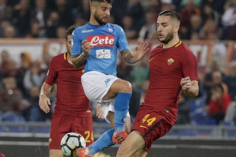Napoli's Lorenzo Insigne, center, is challenged by Roma's Lorenzo Pellegrini, left, and Roma's Kostas Manolas during a Serie A soccer match between Roma and Napoli, at the Rome Olympic Stadium, Saturday, Oct. 14, 2017. (AP Photo/Andrew Medichini)