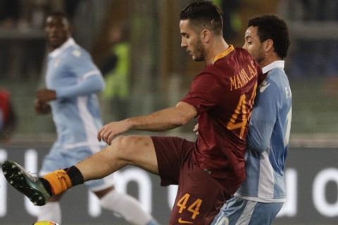 Roma's Kostas Manolas, left, is challenged by Lazio's Felipe Anderson during an Italian Cup, first-leg, semifinal soccer match, at the Rome Olympic stadium, Wednesday, March 1, 2017. (AP Photo/Gregorio Borgia)