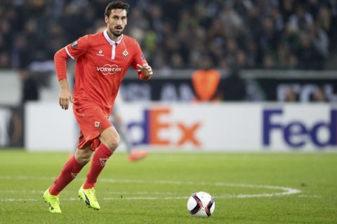 FILE In this Feb. 16, 2017 file photo Davide Astori  of AC Fiorentina  plays the ball during a Europa League match against Borussia Moenchengladbach in Moenchengladbach, Germany. Fiorentina captain Davide Astori has died, the club has announced. He was 31. Astori was found in the early hours of Sunday morning March 4, 2018 in his hotel room in Udine, where the team was staying ahead of an Italian league match. (Marius Becker/dpa via AP)