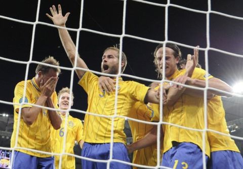 Swedish defender Olof Mellberg (2L) celebrates after scoring against England during the Euro 2012 championships football match Sweden vs England on June 15, 2012 at the Olympic Stadium in Kiev.   AFP PHOTO / DAMIEN MEYER        (Photo credit should read DAMIEN MEYER/AFP/GettyImages)