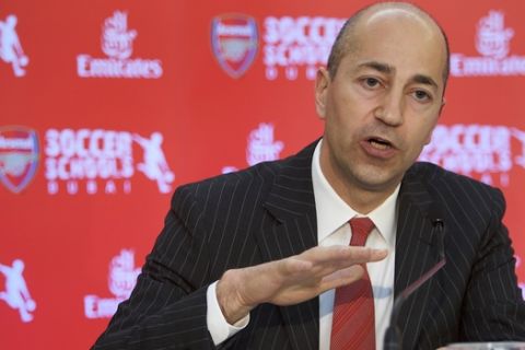 FILE - In this Thursday, May 21, 2009 file photo, Ivan Gazidis, CEO of Arsenal Football Club, speaks during the press conference announcing the partnership of Emirates and Arsenal Football Club in Dubai, United Arab Emirates. With the major honors set to elude Arsenal again in 2015, chief executive Ivan Gazidis says he is "not happy." And Gazidis fears Arsenal will find it harder in future just to maintain its perennial place in the top four Champions League qualification places due to a surge in television cash. (AP Photo/Nousha Salimi, File)