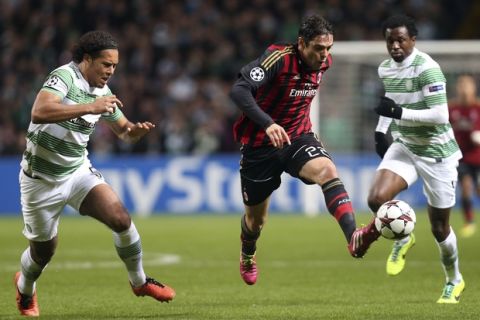 AC Milan's Ricardo Kaka, center, controls the ball past Celtic's Virgil van Dijk, left, and Efe Ambrose during the Champions League group H soccer match between Celtic and AC Milan at Celtic Park in Glasgow, Scotland, Tuesday, Nov. 26, 2013.  (AP Photo/Scott Heppell)