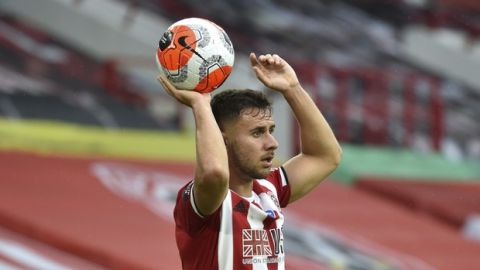 Sheffield United's George Baldock during the English Premier League soccer match between Sheffield United and Wolverhampton Wanderers at Bramall Lane in Sheffield, England, Wednesday, July 8, 2020. (AP Photo/Rui Vieira)