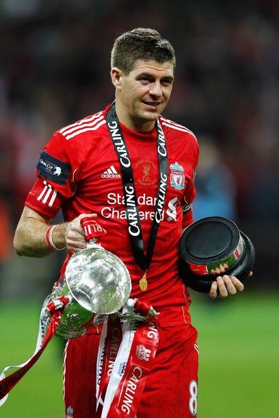 LONDON, ENGLAND - FEBRUARY 26:  Steven Gerrard of Liverpool celebrates with the trophy after victory in the Carling Cup Final match between Liverpool and Cardiff City at Wembley Stadium on February 26, 2012 in London, England. Liverpool won 3-2 on penalties.  (Photo by Paul Gilham/Getty Images)