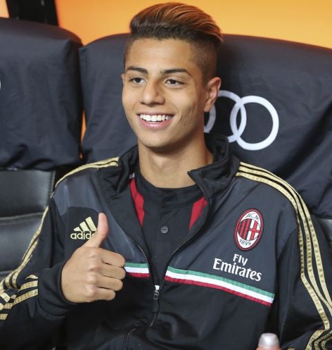 AC Milan midfielder Hachim Mastour smiles prior to the start of the Serie A soccer match between AC Milan and Sassuolo at the San Siro stadium in Milan, Italy, Sunday, May 18, 2014. (AP Photo/Antonio Calanni)