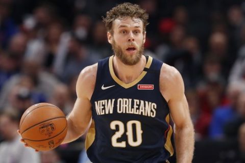 New Orleans Pelicans forward Nicolo Melli brings the ball up court during the second half of an NBA basketball game, Monday, Jan. 13, 2020, in Detroit. (AP Photo/Carlos Osorio)