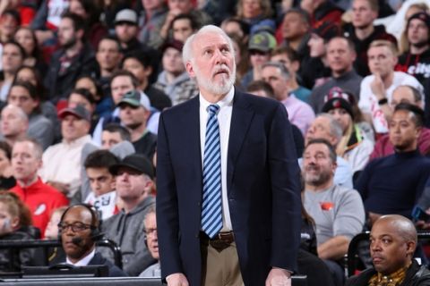 PORTLAND, OR - DECEMBER 20:  Gregg Popovich of the San Antonio Spurs looks on during the game against the Portland Trail Blazers on December 20, 2017 at the Moda Center in Portland, Oregon. NOTE TO USER: User expressly acknowledges and agrees that, by downloading and or using this Photograph, user is consenting to the terms and conditions of the Getty Images License Agreement. Mandatory Copyright Notice: Copyright 2017 NBAE (Photo by Sam Forencich/NBAE via Getty Images)