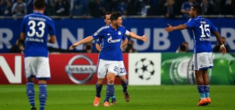 GELSENKIRCHEN, GERMANY - SEPTEMBER 30:  Klaas Jan Huntelaar of FC Schalke 04 celebrates with team-mates after scoring his team's first goal during the UEFA Champions League group G match between FC Schalke 04 and NK Maribor at Veltins Arena on September 30, 2014 in Gelsenkirchen, Germany.  (Photo by Lars Baron/Bongarts/Getty Images)