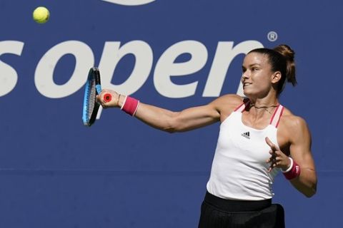 Maria Sakkari, of Greece, returns a shot to Serena Williams, of the United States, during the quarterfinals of the US Open tennis championships, Monday, Sept. 7, 2020, in New York. (AP Photo/Seth Wenig)