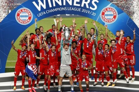Bayern's goalkeeper Manuel Neuer lifts the trophy after Munich won the Champions League final soccer match between Paris Saint-Germain and Bayern Munich at the Luz stadium in Lisbon, Portugal, Sunday, Aug. 23, 2020.(Matthew Childs/Pool via AP)