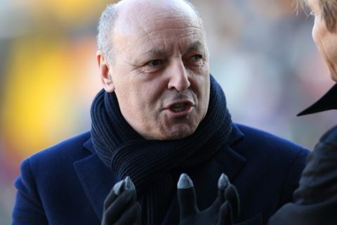 Juventuss President Giuseppe Marotta, talks with Massimo Ambrosini, during the Serie A soccer match between Udinese and Juventus at the Friuli Stadium in Udine, Italy, Sunday, Jan. 17, 2016. (AP Photo/Paolo Giovannini)
