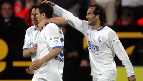 Bochum's Thomas Zdebel from Poland, left, Zvjezdan Misimovic from Bosnia, center, and Theofanis Gekas from Greece, right, jubilate after Misimovic scored the 1-1 during Germany's first soccer league match between VfL Bochum and Schalke 04 in the Rewirpower stadium in Bochum Friday, April 27, 2007. (AP Photo/Roberto Pfeil)*NO MOBILE USE UNTIL 2 HOURS AFTER THE MATCH, WEBSITE USERS ARE OBLIGED TO COMPLY WITH DFL-RESTRICTIONS, SEE INSTRUCTIONS FOR DETAILS**