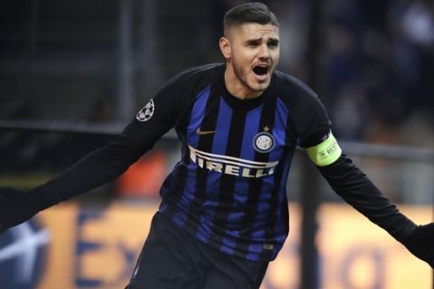 Inter Milan's Mauro Icardi celebrates after scoring his side's opening goal during the Champions League, Group B soccer match between Inter Milan and PSV Eindhoven, at the San Siro stadium in Milan, Italy, Tuesday, Dec. 11, 2018. (AP Photo/Luca Bruno)