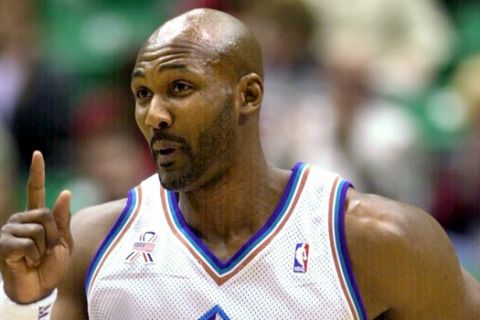 Utah Jazz forward Karl Malone signals his appreciation for the assist against the Detroit Pistons during the first quarter Tuesday, March 19, 2002, in Salt Lake City. Malone earned his 50,000th minute as a player, surpassing Elvin Hayes for second place all-time in the NBA record. (AP Photo/Douglas C. Pizac)