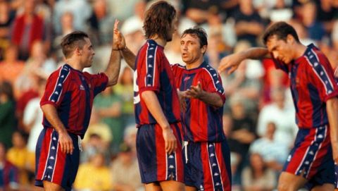 FC Barcelona player Christophe Dugarry (front no 9) and Hristo Stoichkov, 2nd from right, with unidentified teammates as they celebrate their 0-3 victory Friday July 25, 1997 in their friendly training game against Swedish team Elfsborg. (AP Photo/Cicci Johansson)
