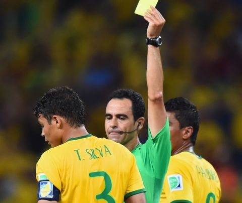 FORTALEZA, BRAZIL - JULY 04:  Thiago Silva of Brazil is shown a yellow card by referee Carlos Velasco Carballo during the 2014 FIFA World Cup Brazil Quarter Final match between Brazil and Colombia at Castelao on July 4, 2014 in Fortaleza, Brazil.  (Photo by Buda Mendes/Getty Images)