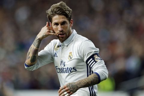 Real Madrid's Sergio Ramos gestures after scoring his side's second goal against Real Betis during a Spanish La Liga soccer match between Real Madrid and Real Betis at the Santiago Bernabeu stadium in Madrid, Sunday, March 12, 2017. Ramos scored the winning goal in Real Madrid's 2-1 victory. (AP Photo/Francisco Seco)
