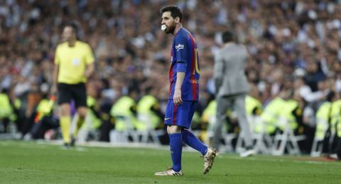 Barcelona's Lionel Messi stands during a Spanish La Liga soccer match between Real Madrid and Barcelona, dubbed 'el clasico', at the Santiago Bernabeu stadium in Madrid, Spain, Sunday, April 23, 2017. (AP Photo/Francisco Seco)