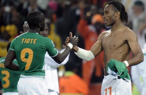 Ivory Coast's Didier Drogba, right, and Ivory Coast's Cheick Tiote, left, greet each other after the World Cup group G soccer match between North Korea and Ivory Coast at Mbombela Stadium in Nelspruit, South Africa, Friday, June 25, 2010.  (AP Photo/Martin Meissner)