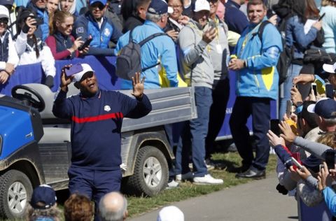 Actor Samuel L Jackson of the US gestures as he arrives at the 1st tee to start the Ryder Cup Celebrity Challenge match at Le Golf National in Saint-Quentin-en-Yvelines, outside Paris, France, Tuesday, Sept. 25, 2018. The 42nd Ryder Cup will be held in France from Sept. 28-30, 2018 at Le Golf National. (AP Photo/Alastair Grant)