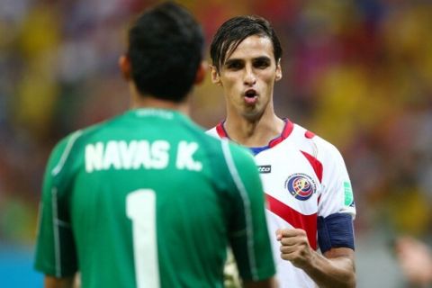 RECIFE, BRAZIL - JUNE 29: Bryan Ruiz of Costa Rica (R) reacts with goalkeeper Keylor Navas after a made penalty kick in a shootout during the 2014 FIFA World Cup Brazil Round of 16 match between Costa Rica and Greece at Arena Pernambuco on June 29, 2014 in Recife, Brazil.  (Photo by Paul Gilham/Getty Images)