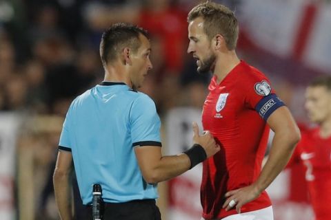 England's Harry Kane, right, speaks with Referee Ivan Bebek during the Euro 2020 group A qualifying soccer match between Bulgaria and England, at the Vasil Levski national stadium, in Sofia, Bulgaria, Monday, Oct. 14, 2019. (AP Photo/Vadim Ghirda)