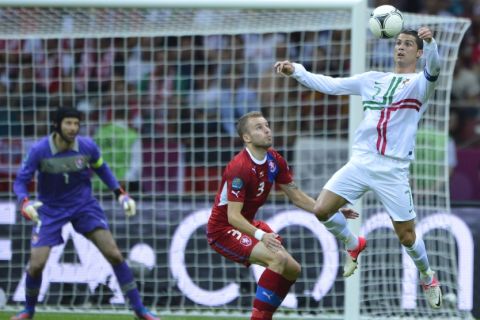 Cristiano Ronaldo (R) of Portugal controls the ball under pressure from Michal Kadlec of the Czech Republic in action during their UEFA EURO 2012 quarter-final