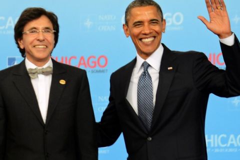NATO Secretary General Anders Fogh Rasmussen (L) and US President Barack Obama (R) greet Prime Minister of Belgium Elio Di Rupo at McCormick Place in Chicago, Illinois, during the NATO 2012 Summit May 20, 2012 . AFP PHOTO Jim WATSON        (Photo credit should read JIM WATSON/AFP/GettyImages)