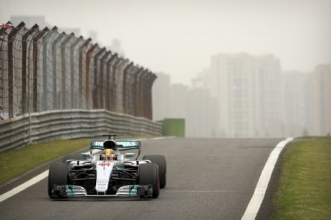 Mercedes driver Lewis Hamilton of Britain steers his car into the pit-lane during the third practice session for the Chinese Formula One Grand Prix at the Shanghai International Circuit in Shanghai, China, Saturday, April 8, 2017. (AP Photo/Mark Schiefelbein)