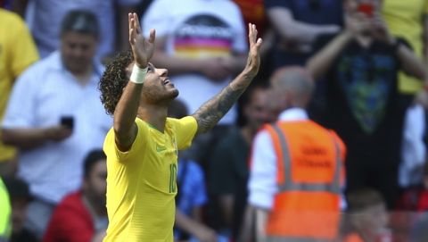 Brazil's Neymar celebrates after scoring his side's opening goal during the friendly soccer match between Brazil and Croatia at Anfield Stadium in Liverpool, England, Sunday, June 3, 2018. (AP Photo/Dave Thompson)