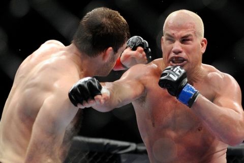 Forrest Griffin, left, and Tito Ortiz battle it out during their UFC 148 light heavyweight fight, Saturday, July 7, 2012, in Las Vegas. Griffin won the bout by a unanimous decision. (AP Photo/David Becker)