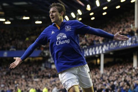 Everton's Nikica Jelavic celebrates after scoring during their English Premier League soccer match against Tottenham Hotspur at Goodison Park in Liverpool, northern England, March 10, 2012. REUTERS/Phil Noble (BRITAIN - Tags: SPORT SOCCER) FOR EDITORIAL USE ONLY. NOT FOR SALE FOR MARKETING OR ADVERTISING CAMPAIGNS. NO USE WITH UNAUTHORIZED AUDIO, VIDEO, DATA, FIXTURE LISTS, CLUB/LEAGUE LOGOS OR "LIVE" SERVICES. ONLINE IN-MATCH USE LIMITED TO 45 IMAGES, NO VIDEO EMULATION. NO USE IN BETTING, GAMES OR SINGLE CLUB/LEAGUE/PLAYER PUBLICATIONS