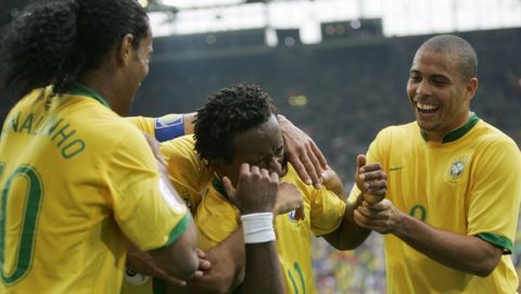 Brazil's Ze Roberto, center, celebrates after scoring with teammates Ronaldinho, left, and Ronaldo, during the World Cup, Round of 16 soccer match between Brazil and Ghana, at the Dortmund stadium, Germany, Tuesday, June 27, 2006. (AP Photo/Martin Meissner) **MOBILE/PDA USAGE OUT**