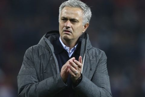 Manchester United's manager Jose Mourinho celebrates and applauds the fan as he walks from the pitch after the end of the Europa League semifinal second leg soccer match between Manchester United and Celta Vigo at Old Trafford in Manchester, England, Thursday, May 11, 2017. Manchester United drew the match but go through to the final 2-1 over both legs. (AP Photo/Dave Thompson)