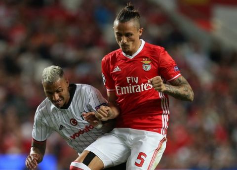 Besiktas' Ricardo Quaresma, left, fights for the ball with Benfica's Ljubomir Fejsa during the Champions League group B soccer match between Benfica and Besiktas at the Luz stadium in Lisbon, Tuesday, Sept. 13, 2016. (AP Photo/Armando Franca)