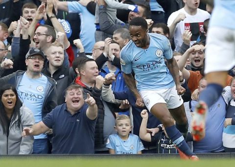 Manchester City's Raheem Sterling celebrates scoring his side's first goal of the game against Brighton & Hove Albion during their English Premier League soccer match at the Etihad Stadium in Manchester, England, Saturday Sept. 29, 2018. (Martin Rickett/PA via AP)