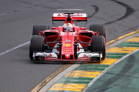 Ferrari driver Sebastian Vettel of Germany goes through turn two during qualifying for the Australian Formula One Grand Prix in Melbourne, Australia, Saturday, March 25, 2017. (AP Photo/Rick Rycroft)
