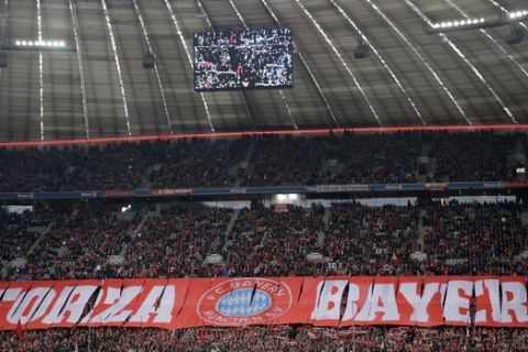 Supporters of Bayern cheer their team prior to the German Bundesliga soccer match between FC Bayern Munich and FC Schalke 04 at the Allianz Arena stadium in Munich, Germany, Saturday, Feb. 4, 2017. (AP Photo/Matthias Schrader)