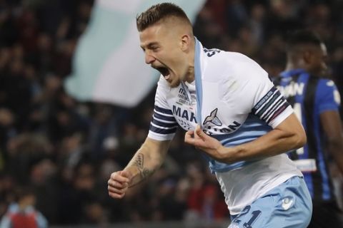Lazio's Sergej Milinkovic Savic celebrates after scoring his side's opening goal during the Italian Cup soccer final match between Lazio and Atalanta, at the Rome Olympic stadium, Wednesday, May 15, 2019. (AP Photo/Alessandra Tarantino)