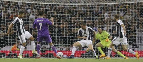 Real Madrid's Cristiano Ronaldo scores during the Champions League final soccer match between Juventus and Real Madrid at the Millennium Stadium in Cardiff, Wales, Saturday June 3, 2017. (AP Photo/Tim Ireland)